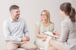 © Photographee.eu - Happy, young couple talking to a clerk in civil registry office, preparing for their wedding