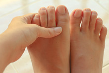 Feet Massage, Massaging Ankle In Pain.