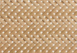 Woven bamboo strips pattern close up. Wickerwork bamboo texture background.