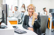 © Bojan - Young beautiful business woman in headset. Call center operator.