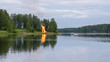 Finland. Midsummer feast, bonfire, boat and lake