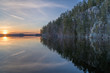 Finland, Laukaa. Sunset on a calm lake Saraavesi and Saraakallio rocks