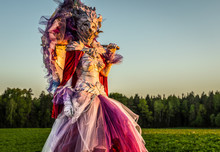 Fairy Tale Woman On Stilts In Bright Fantasy Stylization. Fine Art Outdoor Photo.
