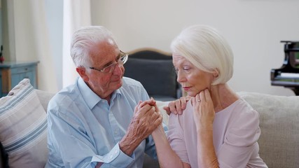 Wall Mural - Senior Man Comforting Woman With Depression At Home