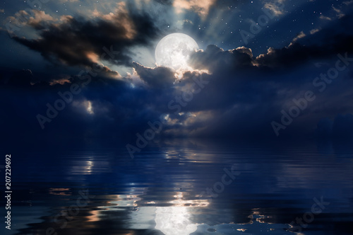 Fotografía Night sky with moon in the clouds Elements of this image furnished by NASA
