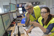 © goodluz - Technicians working in industrial plant control room