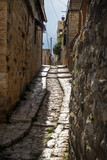 Fototapeta Uliczki - Ancient streets in traditional town Deir el Qamar in vertical position, Lebanon