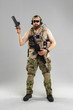 © fotofabrika - Special forces soldier with rifle on white background.