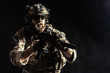 © fotofabrika - Special forces soldier with rifle on dark background