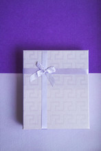 Purple Gift Box On Purple Background