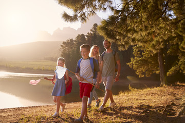 Wall Mural - Children Walk By Lake With Parents On Family Hiking Adventure