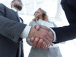 © ASDF - Photo of handshake of two happy businessmen