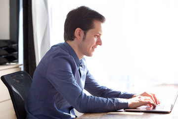 happy business man working on laptop