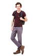 © mimagephotos - Full length cool college student with earphones listening to music