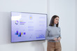 © LStockStudio - Businesswoman Presenting in Front of Audience