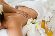 Young beautiful Asian woman sleep relaxing in the Oil spa massage in salon. Select focus hand of masseuse
