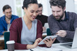© LStockStudio - Man and Woman Looking at Tablet