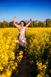 © Volodymyr Shevchuk - jumping girl in rape field