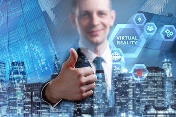 Business, Technology, Internet and network concept. Young businessman working on a virtual screen of the future and sees the inscription: Virtual reality