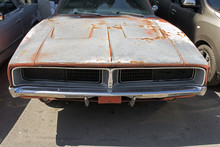 Front View Of A Rusty Classic American Muscle Car