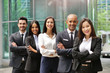 © Kitreel - Portrait of business people of different ethnic backgrounds dressed in suits, they smile and cross their arms. Concept of: internationality and career, cooperation and team.