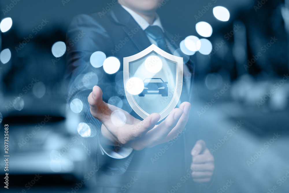 Man shows a shield with the auto.