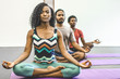 © Gerald Carter/Creative Flame - Group of people practicing yoga in the gym