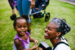 © Gerald Carter/Creative Flame - Smiling mother and daughter sitting in the park
