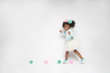 © CreativeSoul/Creative Flame - Portrait of girl playing against white background