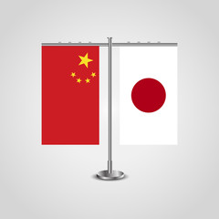 Wall Mural - Table stand with flags of China and Japan.Two flag. Flag pole. Symbolizing the cooperation between the two countries. Table flags