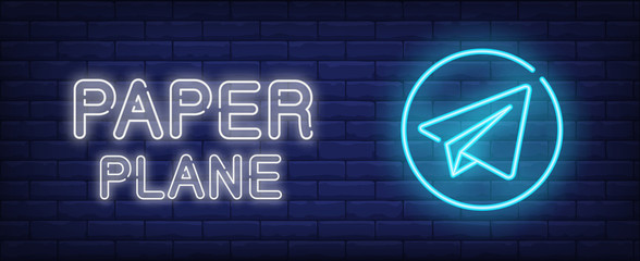 Poster - Paper plane neon style banner on brick background. Airplane emblem with lettering. Message, airport, travel. Can be used for advertising, signboard, web design