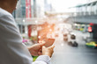 © Love You Stock - Businessman touching screen of smartphone and sent electronics mail or email with web icons globalization on traffic blurry background. New messages on mobile phone with copy space.