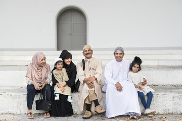 Sticker - Muslim family sitting together outdoors