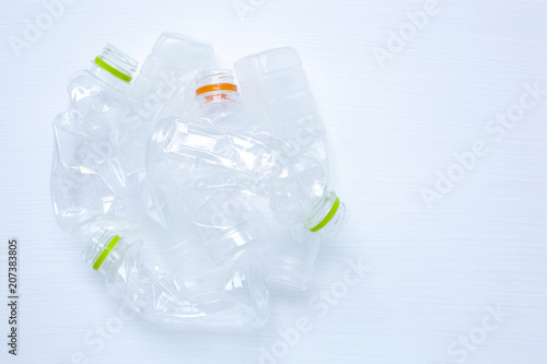 Fotografering Empty plastic water bottle for recycling isolated.