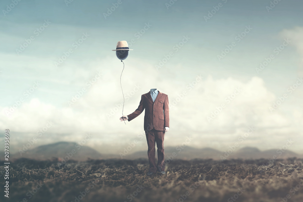 man without head holds black balloon with hat surreal concept - obrazy, fototapety, plakaty 