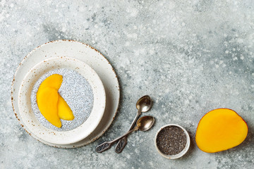 Wall Mural - Healthy breakfast set. Chia seed pudding bowls with mango.