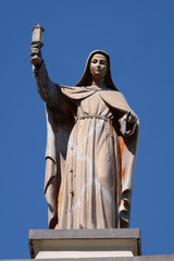 Wall Mural - Saint Clare of Assisi statue on Franciscan church in Shkoder, Albania.