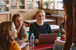 © Jacob Lund - Students chatting in university classroom