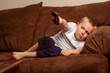 © Tracy King - boy laying down watching tv