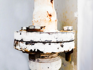 joint of two flanges by bolts and nuts, Bolts base Blurred soft focus,  Fastening base column, Old rusty steel nut