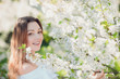 © Volodymyr Shcherbak - Close up romantic portrait of beautiful elegant woman in blossom spring trees.