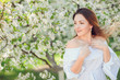 © Volodymyr Shcherbak - Close up romantic portrait of beautiful elegant woman in blossom spring trees.