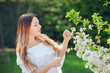 © Volodymyr Shcherbak - Close up romantic portrait of beautiful elegant woman in blossom spring trees.