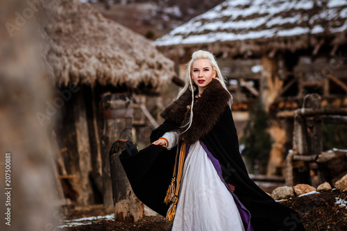 Fotografie, Obraz Beautiful young woman holding a viking with blond hair