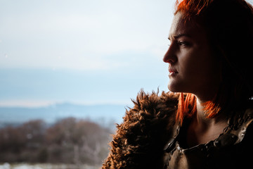 Viking woman in a traditional warrior clothes.