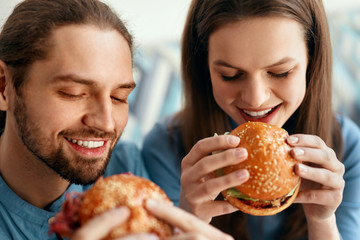 Wall Mural - Friends Eating Burgers Indoors