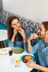 Wall Mural - Friends Eating Burgers Indoors