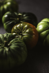 Moody close-up of green tomato