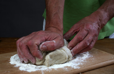 Baker preparing some dough ready to bake some bread