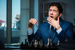 © Elnur - Businessman playing chess in strategy concept